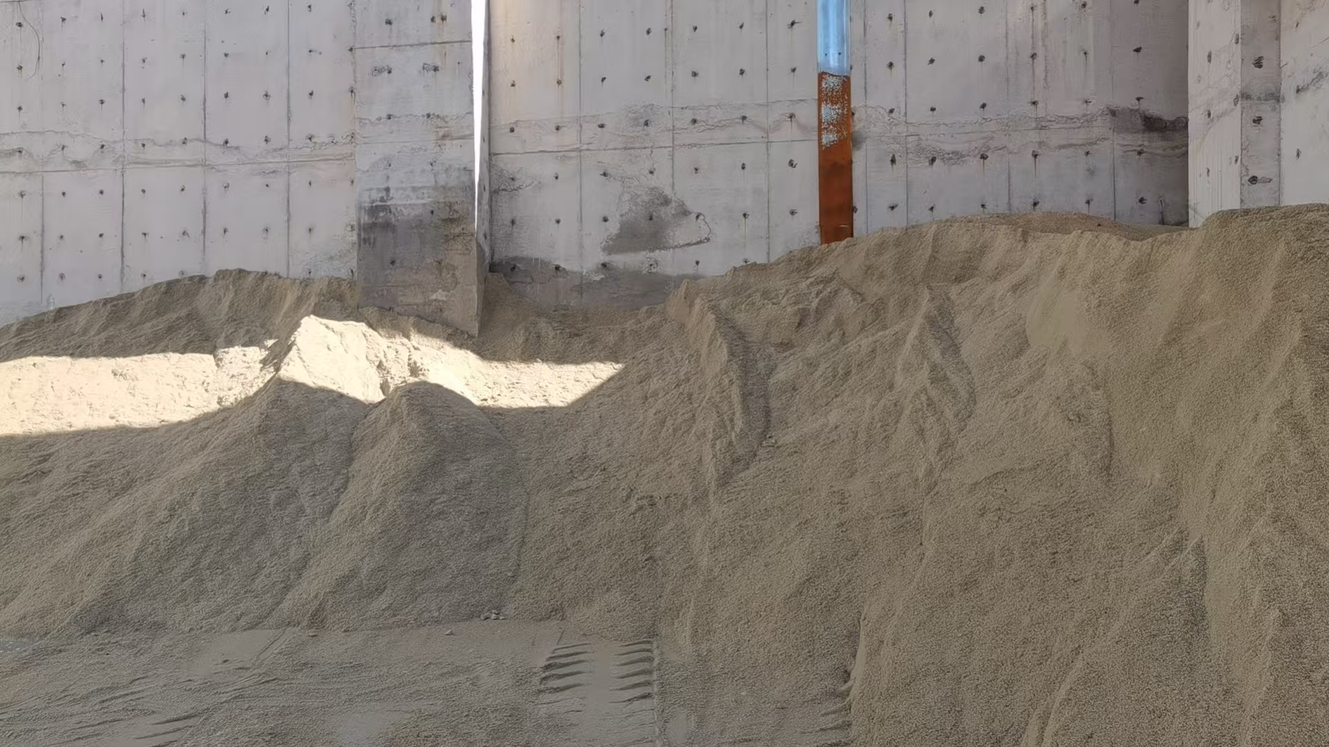 Dry bulk vessel loading slag materials at port for European export