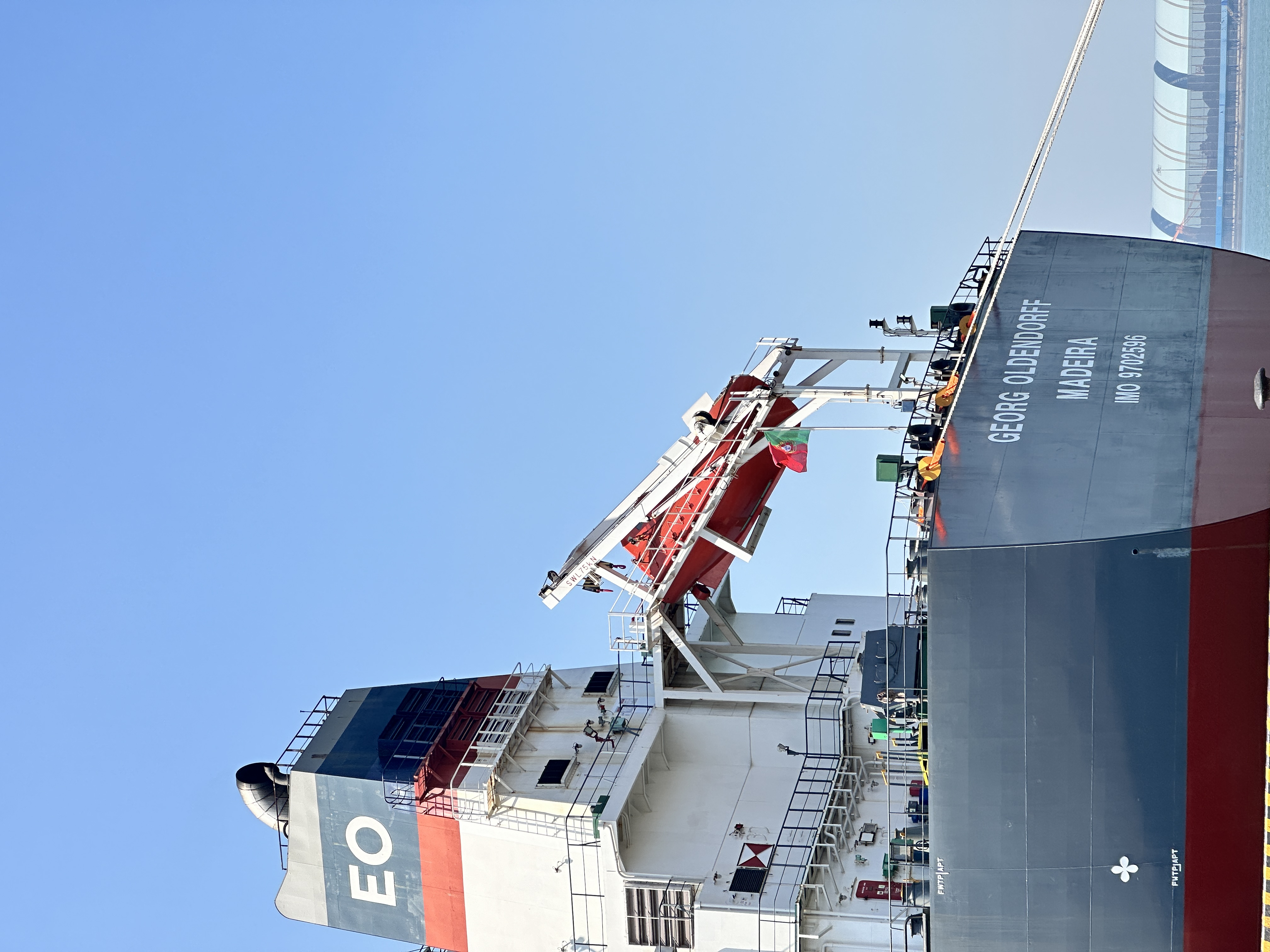 Strait of Hormuz shipping lane with dry bulk vessels and energy infrastructure