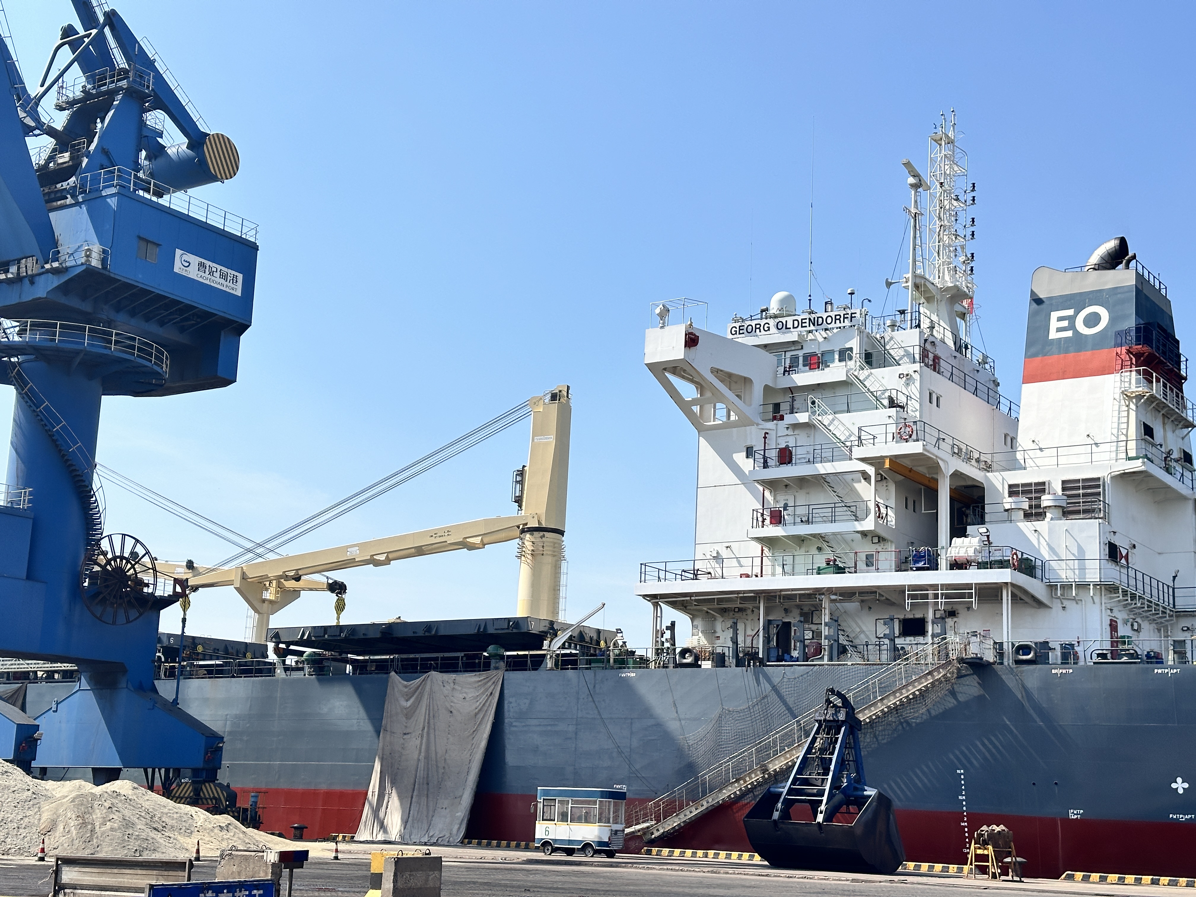 Red Sea shipping corridor with container and bulk vessels near Saudi port