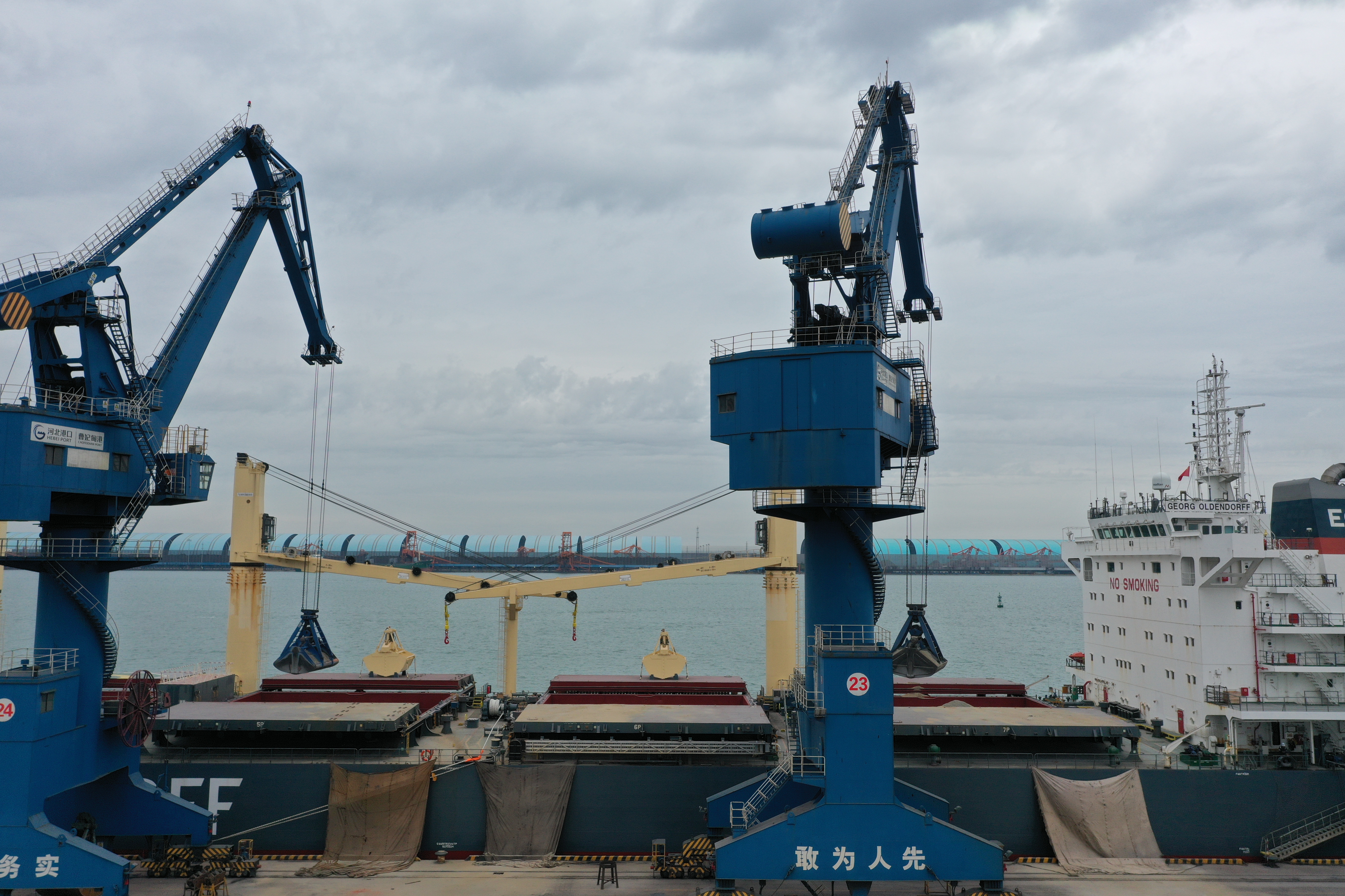 Cement export stockyard and port-linked grinding or storage operations in Southeast Asia