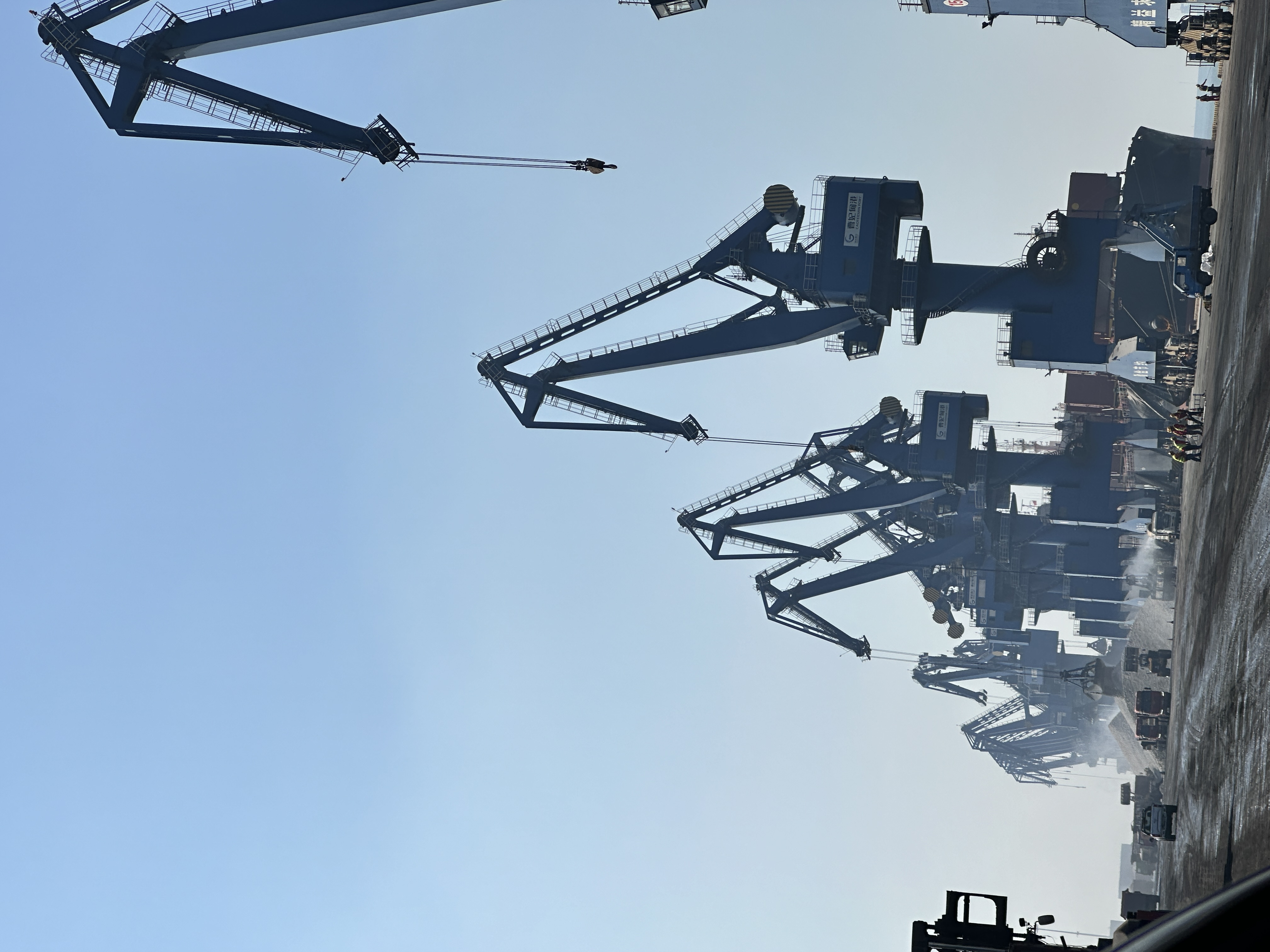 Port stockyard scene representing the logistics side of cement and clinker supply